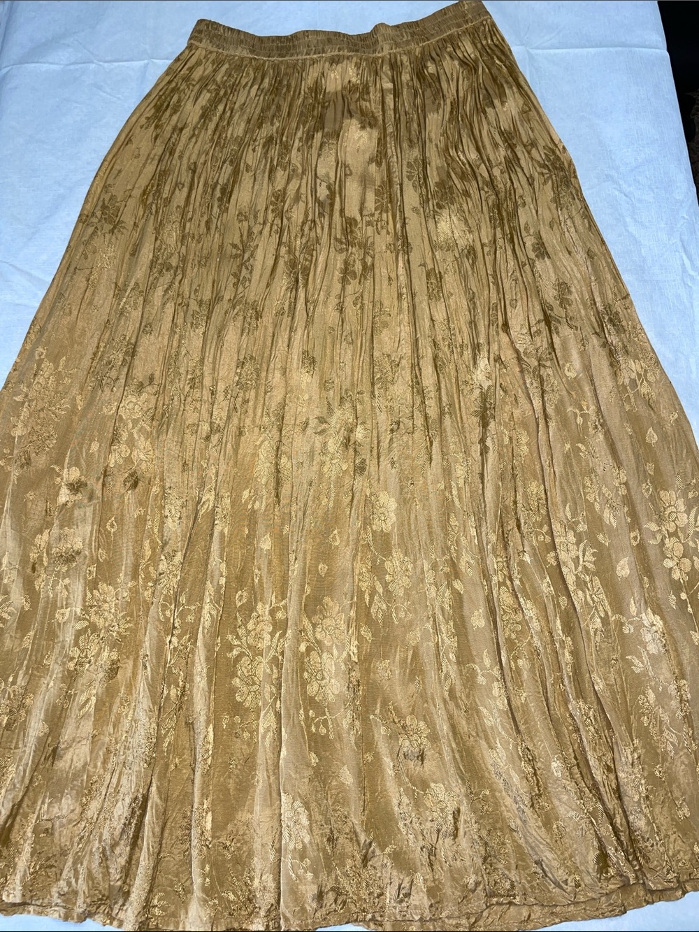 Gold metallic skirt by Huntington Ridge featuring a smocked waistband. Size M